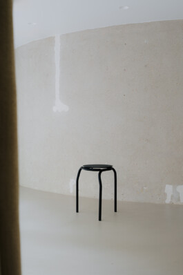 Stool in front concrete wall