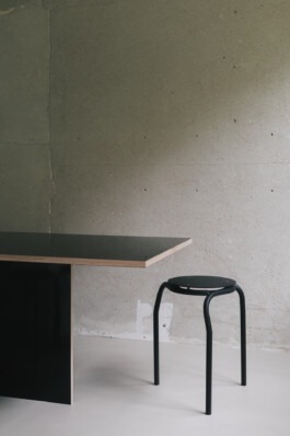 Stool in front concrete wall 