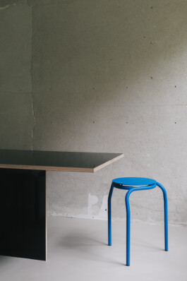 Stool in front concrete wall