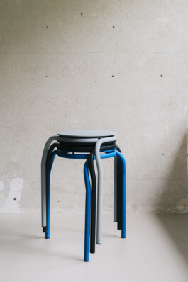 Stool in front concrete wall